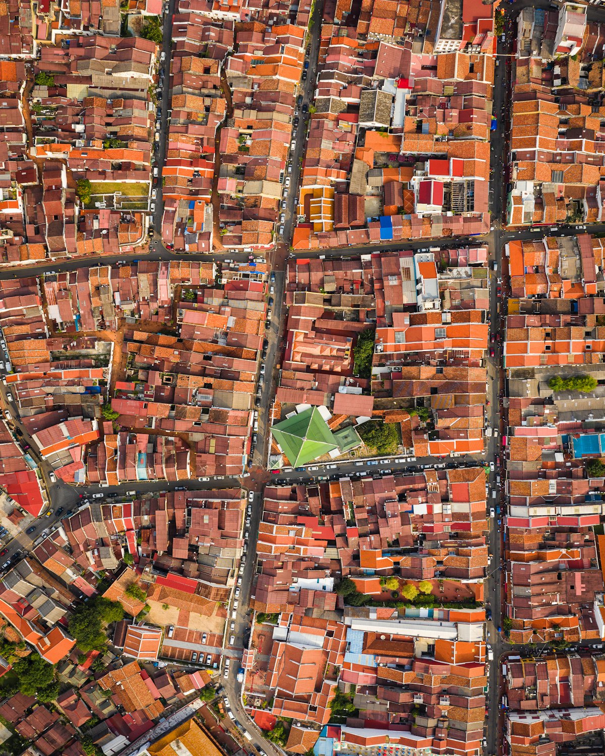Aerial view of a city grid of streets and rooftops